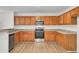 Modern kitchen with wood cabinets, granite counters, and stainless steel appliances at 1112 Moss Grove Dr, Moncks Corner, SC 29461