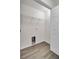 Laundry closet with wood-look vinyl flooring and shelving at 1112 Moss Grove Dr, Moncks Corner, SC 29461