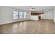 Living room with vinyl flooring and kitchen views at 1112 Moss Grove Dr, Moncks Corner, SC 29461