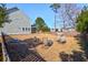 Large backyard with wooden fence, fire pit, and seating at 1320 Raven Rd, Hanahan, SC 29410