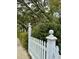 White picket fence lines a sidewalk, creating curb appeal at 12 John St # Includes 8 & 10, Charleston, SC 29403