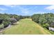 Aerial view of golf course with lush green fairways and mature trees at 1287 Hogans Aly, Mount Pleasant, SC 29466