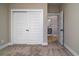 Bedroom with closet featuring neutral carpet, white trim, and ensuite bathroom view at 2513 Celestial Ct, Charleston, SC 29406