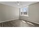 Bedroom featuring ceiling fan, window and wooden floors at 9049 Delancey Cir, North Charleston, SC 29406
