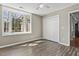 Bedroom with ceiling fan, wooden floors, and double closet doors at 9049 Delancey Cir, North Charleston, SC 29406