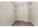Walk-in closet with wooden floors and metal shelves at 9049 Delancey Cir, North Charleston, SC 29406