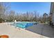 Outdoor community pool with lounge seating, railings and a secure gated entrance at 9049 Delancey Cir, North Charleston, SC 29406