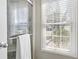 Walk-in shower with glass door and window with white blinds at 9049 Delancey Cir, North Charleston, SC 29406
