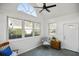 Sunroom featuring a vaulted ceiling, arched transom window, and slate floors leading to the door at 9049 Delancey Cir, North Charleston, SC 29406
