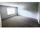Spacious carpeted bedroom with natural light from the window at 3005 Dalmore Dr, Ravenel, SC 29470