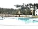 Community swimming pool with mature trees in the background at 3005 Dalmore Dr, Ravenel, SC 29470