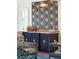 Stylish home bar with a marble countertop and tiger wallpaper at 436 Church St, Mount Pleasant, SC 29464