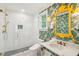 Spa-like bathroom with marble vanity and patterned wallpaper at 436 Church St, Mount Pleasant, SC 29464
