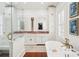 Bright bathroom with double vanity, soaking tub, and walk-in shower at 436 Church St, Mount Pleasant, SC 29464