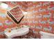 Stylish powder room with marble vanity and bold wallpaper at 436 Church St, Mount Pleasant, SC 29464