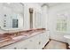 Luxurious bathroom with double vanity, pink marble, and a soaking tub at 436 Church St, Mount Pleasant, SC 29464