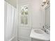Clean bathroom with marble vanity and a shower/tub combo at 436 Church St, Mount Pleasant, SC 29464