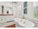 Bathroom with freestanding tub and large vanity with pink marble top at 436 Church St, Mount Pleasant, SC 29464