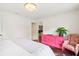 Serene bedroom with a pink dresser and patterned armchair at 436 Church St, Mount Pleasant, SC 29464