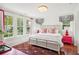 Charming bedroom with a white bed frame and colorful rug at 436 Church St, Mount Pleasant, SC 29464
