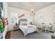 Cozy bedroom with a colorful ceiling, and a desk area at 436 Church St, Mount Pleasant, SC 29464