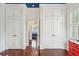 Hardwood floors and built-in storage highlight this bedroom at 436 Church St, Mount Pleasant, SC 29464