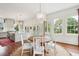 Bright dining area with a round wooden table and white chairs, overlooking the backyard at 436 Church St, Mount Pleasant, SC 29464