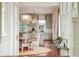 Open concept dining area with a round wooden table and white chairs, adjacent to the kitchen at 436 Church St, Mount Pleasant, SC 29464