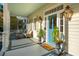 Inviting front porch with blue door and potted plants at 436 Church St, Mount Pleasant, SC 29464