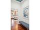 Elegant hallway with hardwood floors and a striped bench at 436 Church St, Mount Pleasant, SC 29464