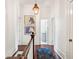 Charming hallway with hardwood floors and artwork at 436 Church St, Mount Pleasant, SC 29464
