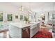 Kitchen features marble island, farm sink, and access to backyard at 436 Church St, Mount Pleasant, SC 29464