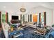 Bright living room featuring comfortable seating and large windows at 436 Church St, Mount Pleasant, SC 29464