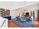 Large living room with hardwood floors, a statement wall, and comfortable seating at 436 Church St, Mount Pleasant, SC 29464