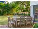 Brick patio with wooden table and chairs, perfect for outdoor dining at 436 Church St, Mount Pleasant, SC 29464