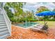 Relaxing pool area with lounge chairs and brick patio at 436 Church St, Mount Pleasant, SC 29464