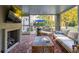 Outdoor living space with a fireplace, comfortable seating, and a view of the pool at 436 Church St, Mount Pleasant, SC 29464