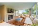 Cozy screened porch with brick flooring, fireplace, and comfortable seating at 436 Church St, Mount Pleasant, SC 29464