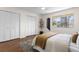 Spacious bedroom featuring a king bed, hardwood floors, a window and double door closets at 4796 Champion Way # C, North Charleston, SC 29418