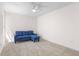 Bonus room with neutral carpet, a ceiling fan and a comfy blue couch at 4796 Champion Way # C, North Charleston, SC 29418