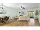 Bright and airy living room featuring a fireplace, wood floors, and comfortable seating arrangement at 4796 Champion Way # C, North Charleston, SC 29418