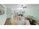 Open concept living space with wood floors seamlessly connects to a modern kitchen at 4796 Champion Way # C, North Charleston, SC 29418