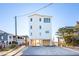 Beach house with three stories and open parking at 1579 E Ashley Ave, Folly Beach, SC 29439