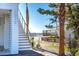 Modern stairs leading to beach house entryway at 1579 E Ashley Ave, Folly Beach, SC 29439