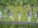 Aerial view of houses with green lawns and tree lined street at 1625 Pimlico Blvd, Moncks Corner, SC 29461