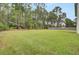 Large backyard with lush grass and tree line at 1625 Pimlico Blvd, Moncks Corner, SC 29461
