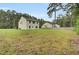 Spacious backyard with fenced area and mature trees at 1625 Pimlico Blvd, Moncks Corner, SC 29461