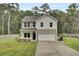 Two-story house with attached garage and landscaped lawn at 1625 Pimlico Blvd, Moncks Corner, SC 29461
