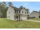 Two-story house with attached garage, and landscaped lawn at 1625 Pimlico Blvd, Moncks Corner, SC 29461