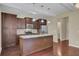 Kitchen features dark wood cabinets and granite countertops at 1625 Pimlico Blvd, Moncks Corner, SC 29461